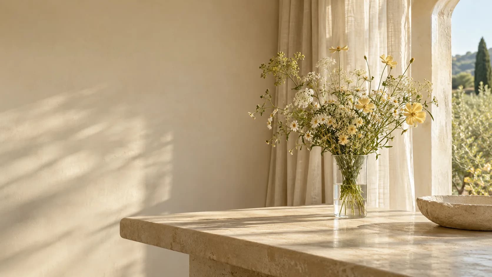 Original creative reference: sunlit linen interior with a clear glass vase of wildflowers and warm architectural shadows; not a Seedream output